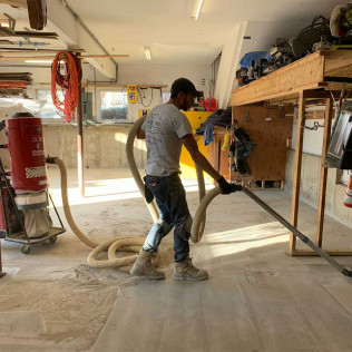 man cleaning concrete flooring